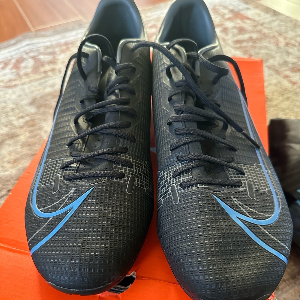 Brand new men’s size 12 Nike mercurial cleats . Comes with box and shoe bag